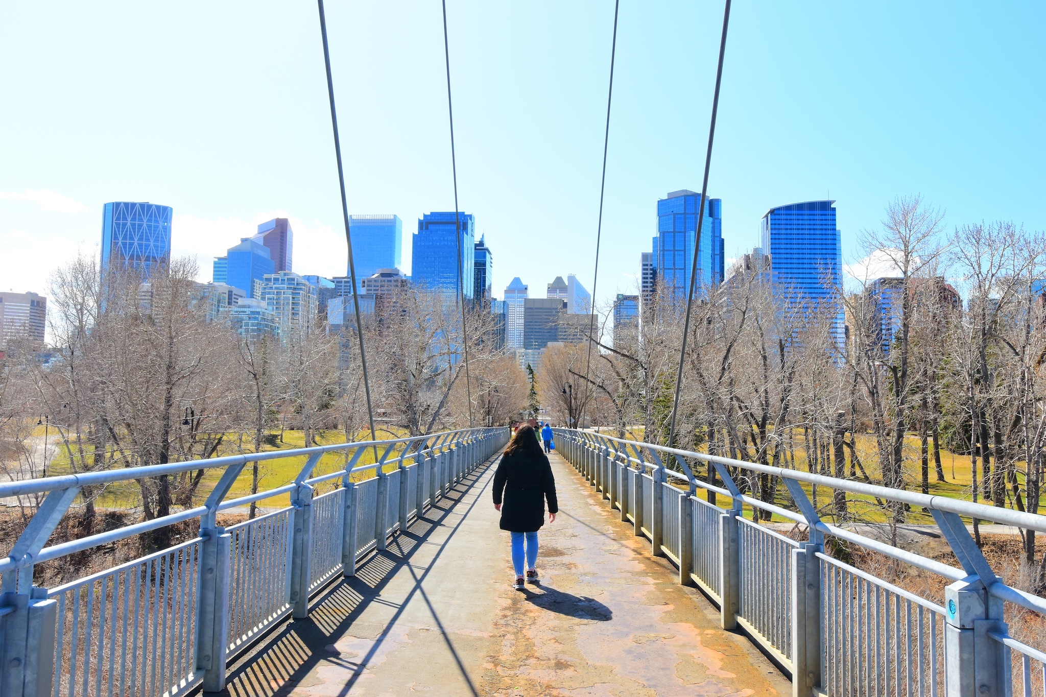 person walking along river pathway in Calgary